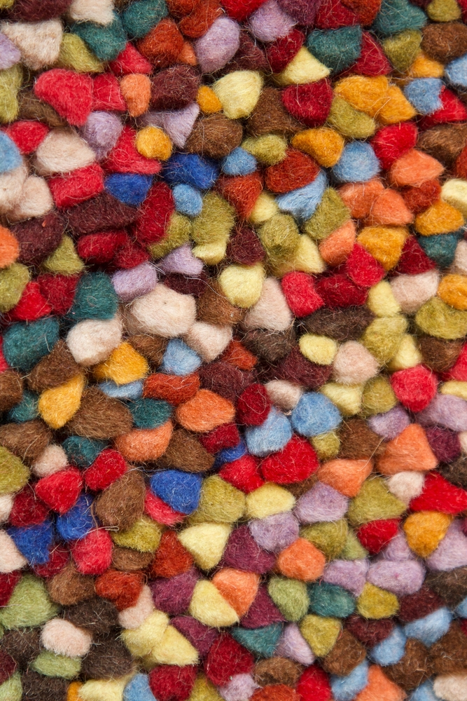 Disfigured felt wool ball rug